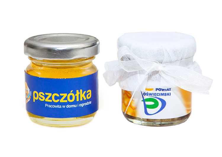 Upominek promocyjny – miód w słoiczku z logo firmy i ozdobnym wykończeniem